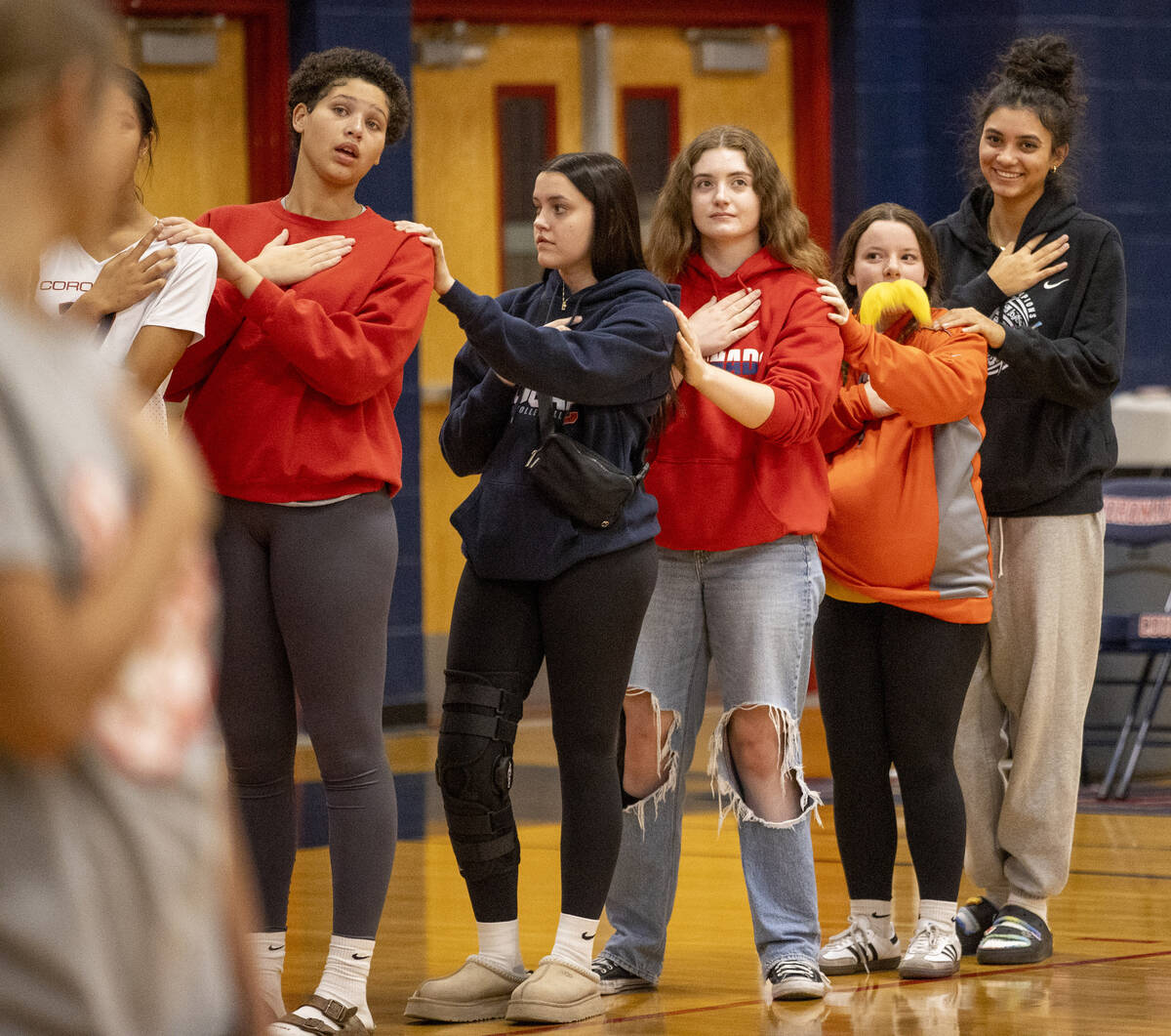 Coronado Team Manager Sammi Ellis, second from right and dressed as The Lorax, stands at attent ...