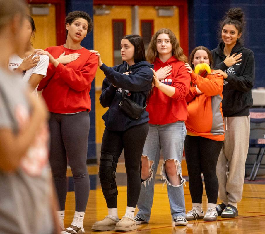 Coronado Team Manager Sammi Ellis, second from right and dressed as The Lorax, stands at attent ...