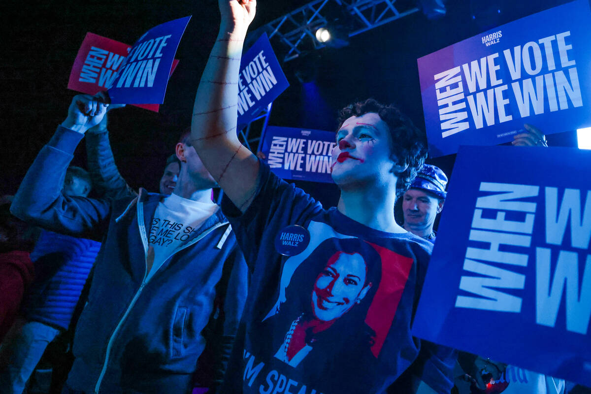 Supporters wait for Democratic presidential nominee Vice President Kamala Harris to speak durin ...