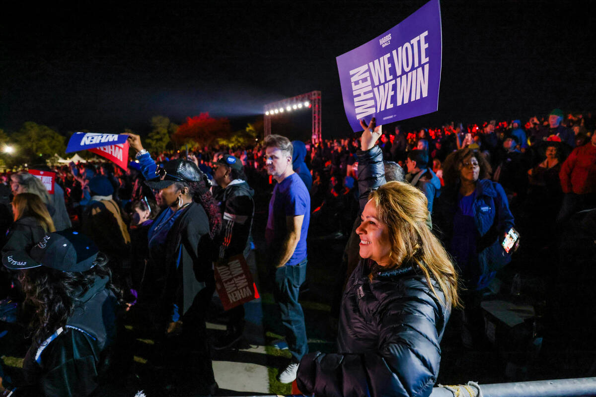 Supporters wait for Democratic presidential nominee Vice President Kamala Harris to speak durin ...