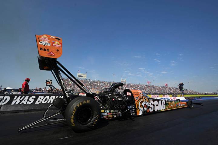 In this photo provided by the NHRA, Justin Ashley competes in the Top Fuel of the Texas NHRA Fa ...