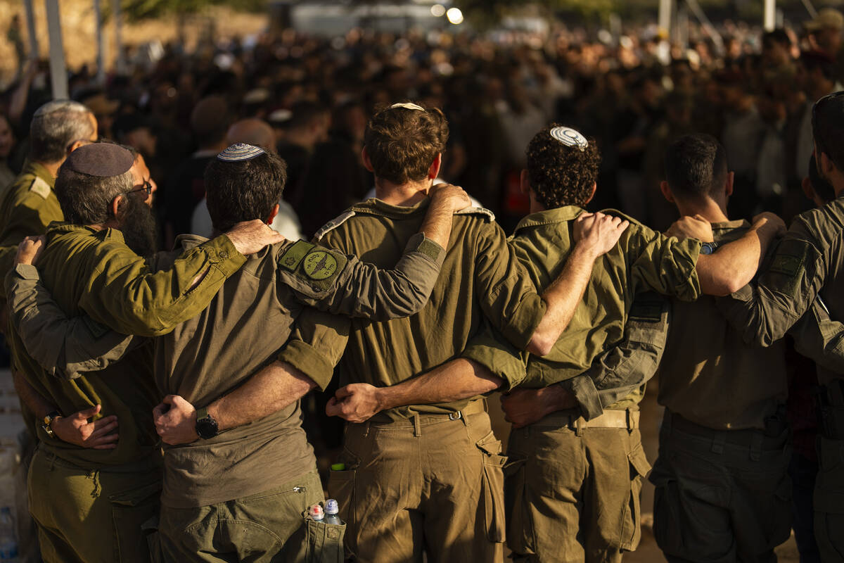 Israeli soldiers mourn during the funeral of reservist Yedidia Bloch, 31, at Mevo Horon settlem ...