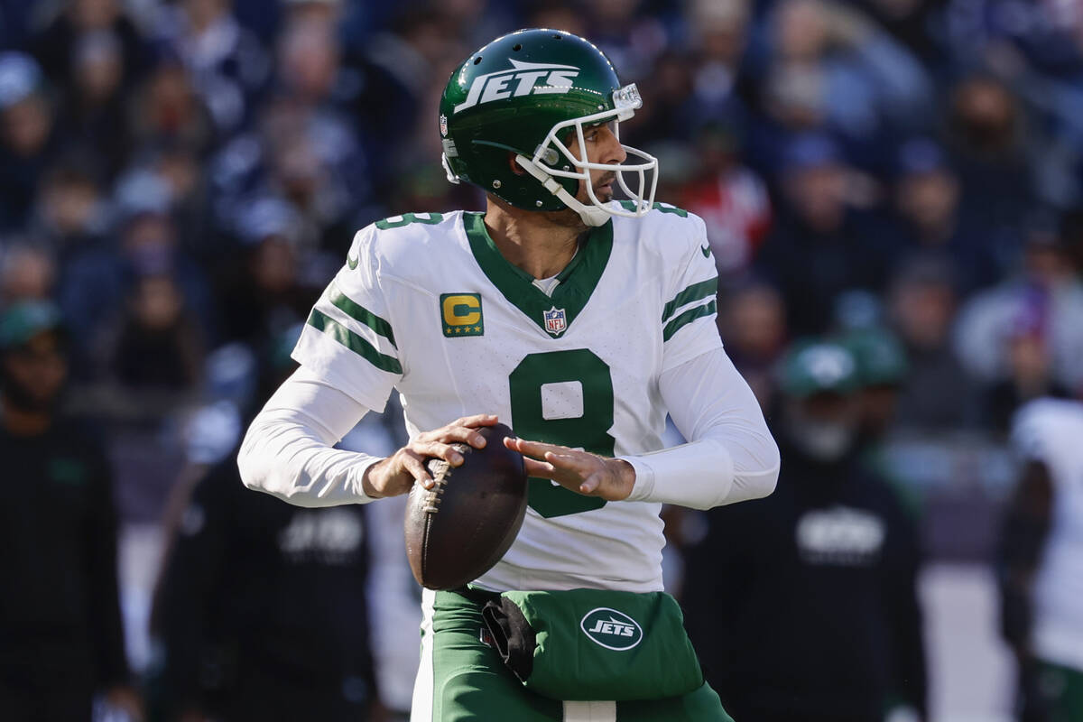 New York Jets quarterback Aaron Rodgers (8) prepares to make a pass during the second half of a ...