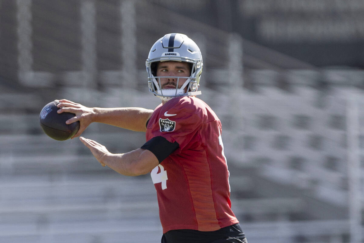 Raiders quarterback Carter Bradley (14) throws the football during team practice at the Intermo ...