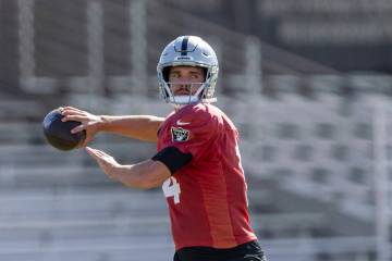 Raiders quarterback Carter Bradley (14) throws the football during team practice at the Intermo ...