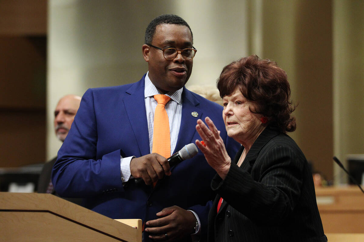 Las Vegas Council members Cedric Crear, left, looks on as Lois Tarkanian, recognize the Bishop ...