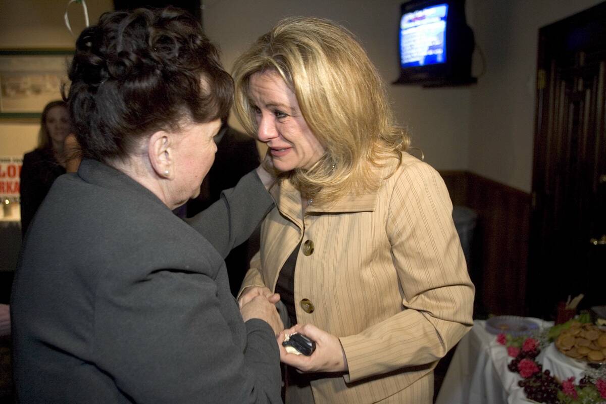 Recalled Councilwoman Janet Moncrief weeps as she congratulates Lois Tarkanian for winning her ...