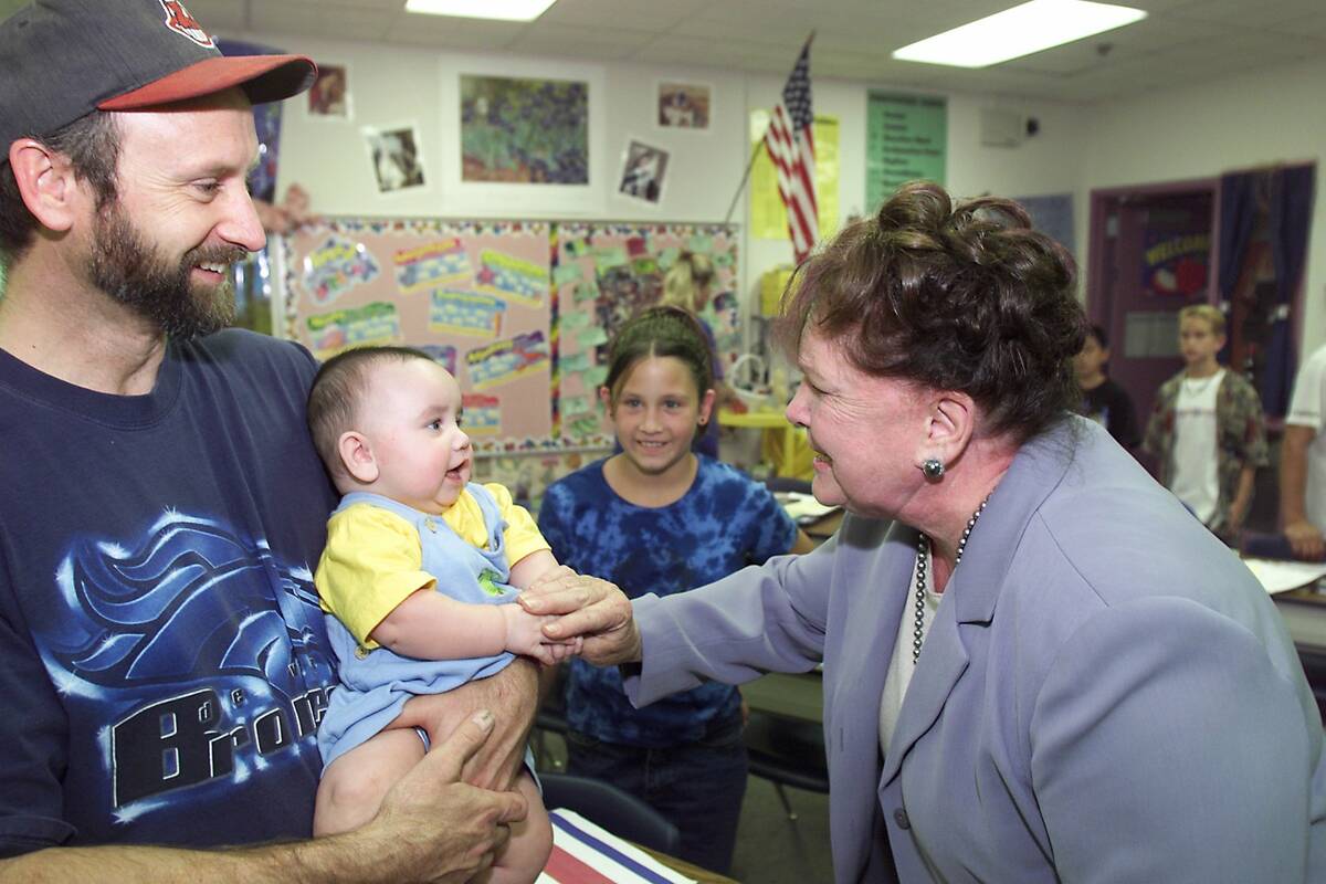 Clark County Commission candidate Lois Tarkanian says hello to 5-month-old Josh Jordan and his ...