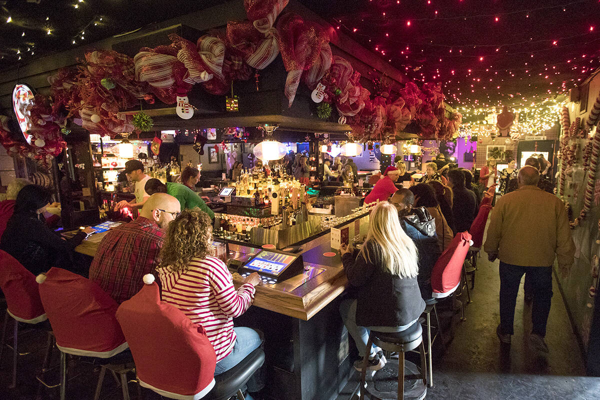 Guests at the bar of the Sand Dollar Lounge in Las Vegas, Monday, Nov. 25, 2019. The bar is hos ...