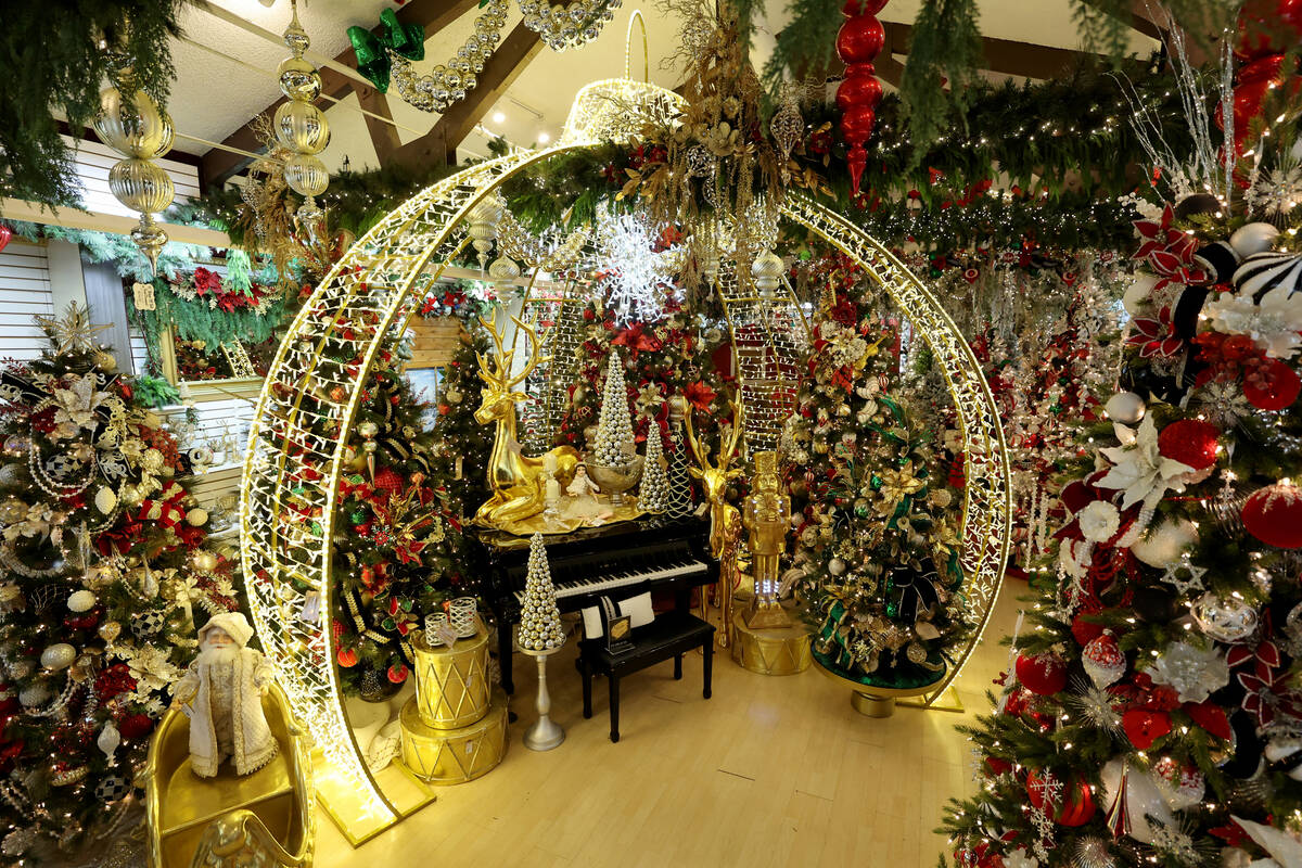 Christmas decorations, including a room-size ornament, are set up for sale at Ralph Jones Displ ...