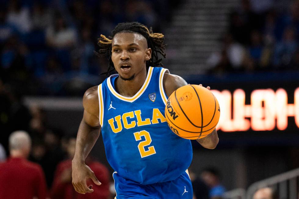 FILE - UCLA guard Dylan Andrews (2) dribbles during an NCAA college basketball game against Sou ...