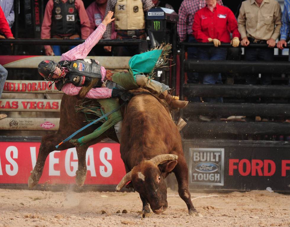 PRCA bull rider Roscoe Jarboe is bucked from his bull during the Helldorado Days rodeo at the L ...