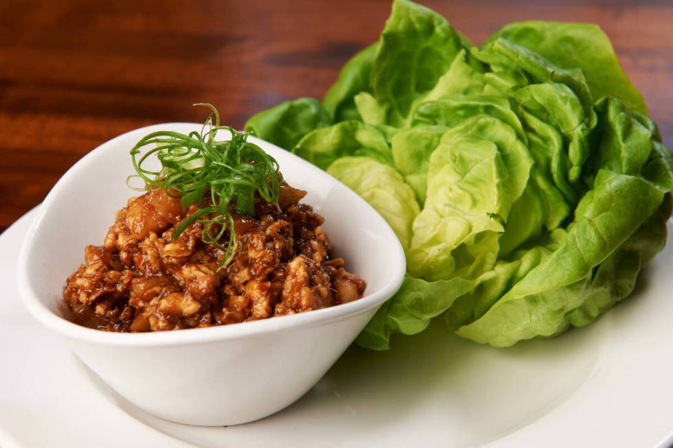 Chicken and lettuce cups are among the shareable plates that are half-off during happy hour at ...