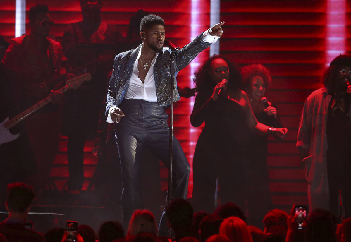 Usher performs during a Prince tribute at the 62nd annual Grammy Awards on Sunday, Jan. 26, 202 ...