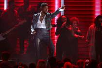 Usher performs during a Prince tribute at the 62nd annual Grammy Awards on Sunday, Jan. 26, 202 ...