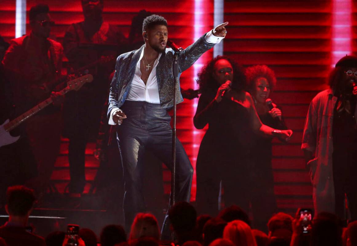 Usher performs during a Prince tribute at the 62nd annual Grammy Awards on Sunday, Jan. 26, 202 ...