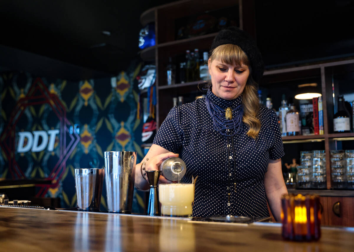 Co-owner Suzanne Tyson prepares a cocktail at DDT, a professional wrestling- themed bar in down ...