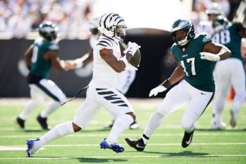 Cincinnati Bengals wide receiver Ja'Marr Chase (1) carries the ball during an NFL football game ...