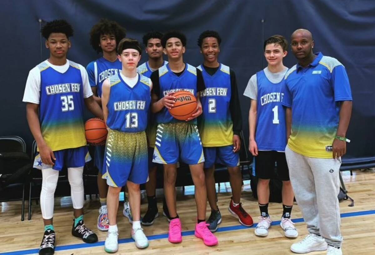 Select Few, a youth basketball team based in Vegas, poses for a photo with Coach Abdul Adem (fa ...