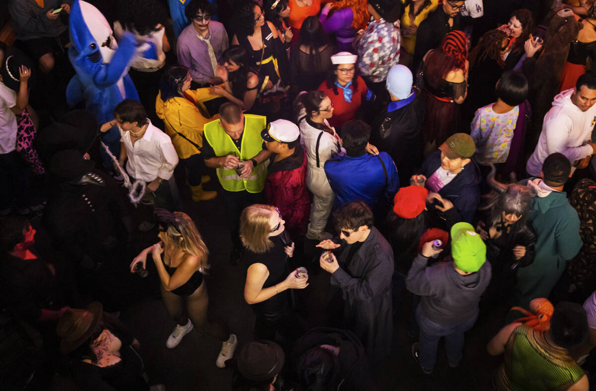 People dance at Oddfellows during Halloween night on the early hours of Friday, Nov. 1, 2024, ...