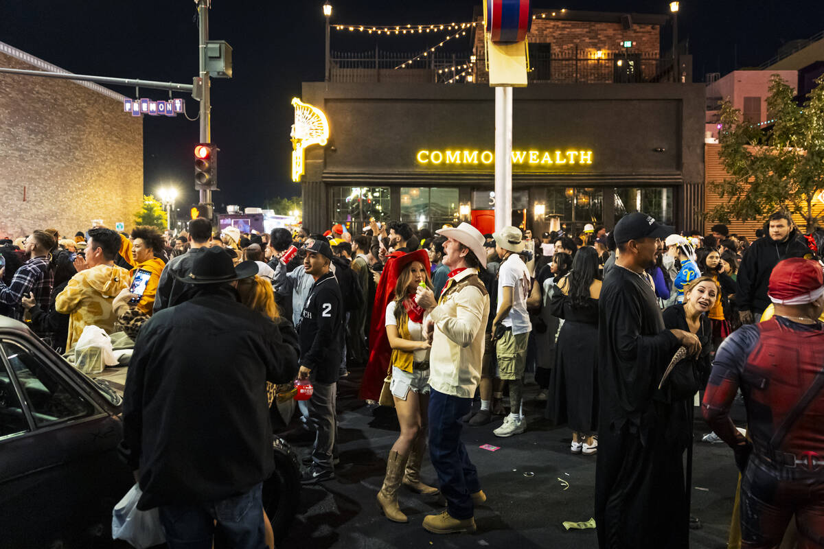 People dance along Fremont Street during Halloween night on Friday, Nov. 1, 2024, in Las Vegas. ...