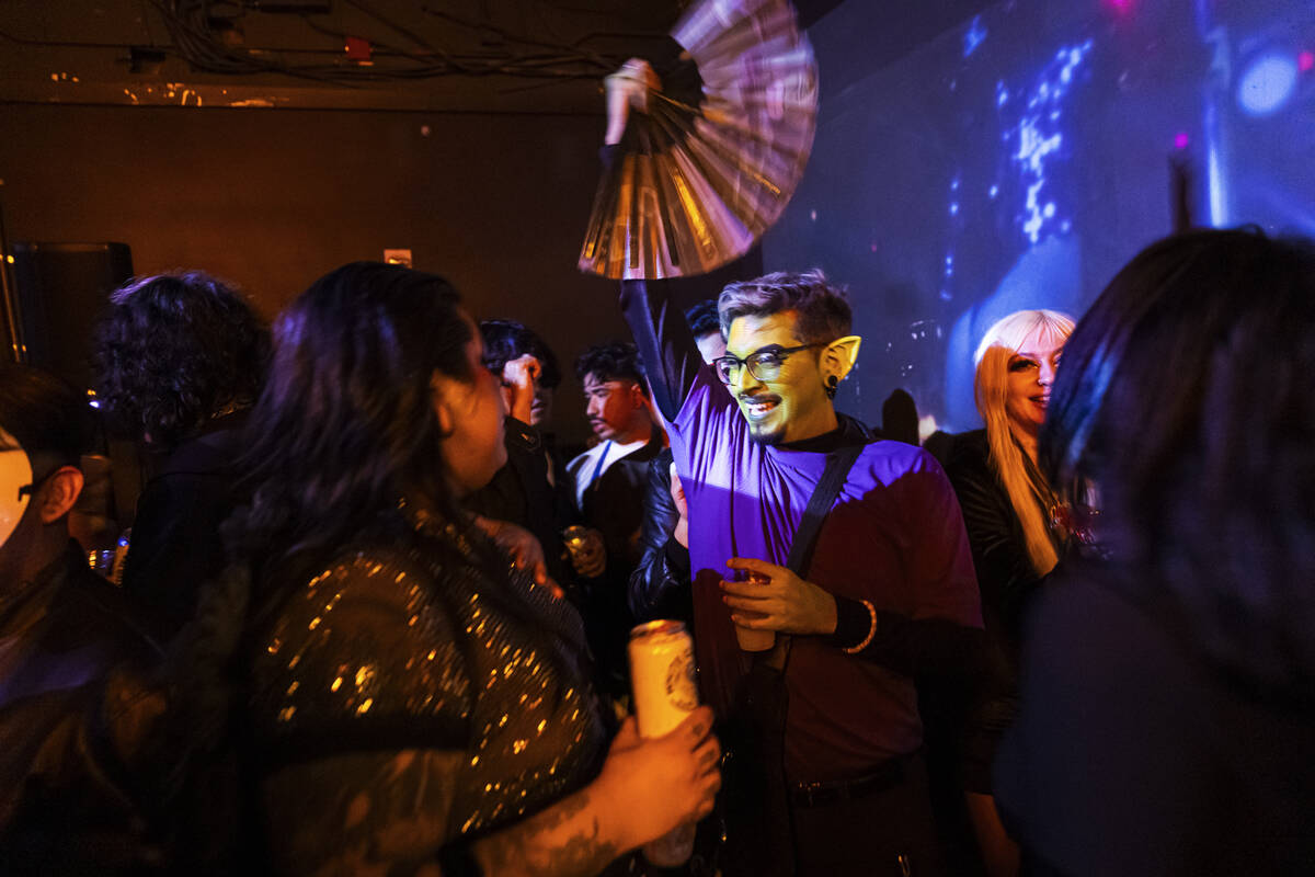 People dance at Oddfellows during Halloween night on the early hours of Friday, Nov. 1, 2024, ...