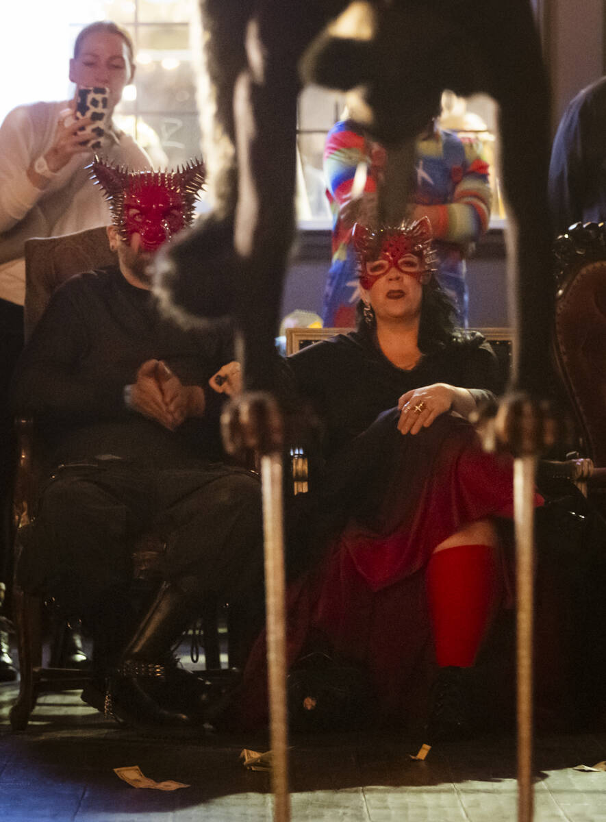 Attendees watch as contortionist Mariama performs during the Cauldron Noir burlesque and variet ...