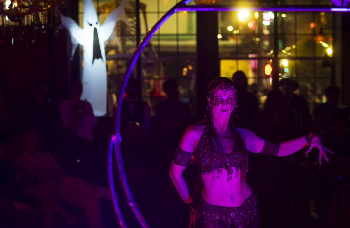 Mila performs during the Cauldron Noir burlesque and variety show at Commonwealth on Halloween ...