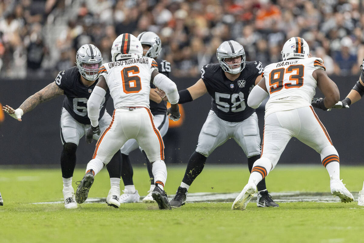 Raiders center Andre James (68) and guard Jackson Powers-Johnson (58) protect the pocket agains ...