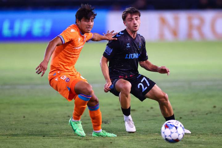 Miami FC forward Isaac Zuleta defends while Las Vegas Lights FC midfielder Valentin Noël ( ...