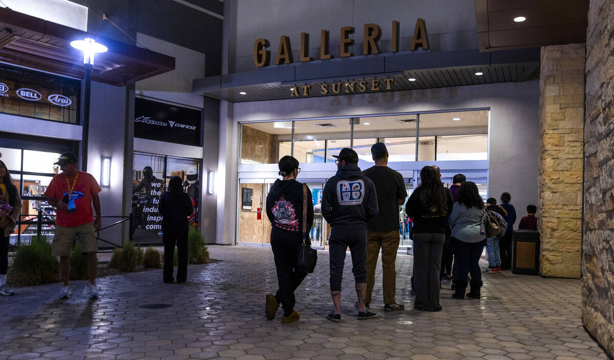 The line starts outside as voters wait for nearly 100 minutes to cast their ballots in a pollin ...