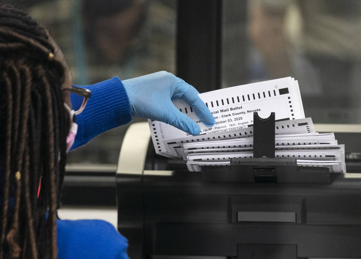 A Clark County election worker scans ballots at the Election Department warehouse, on Tuesday, ...