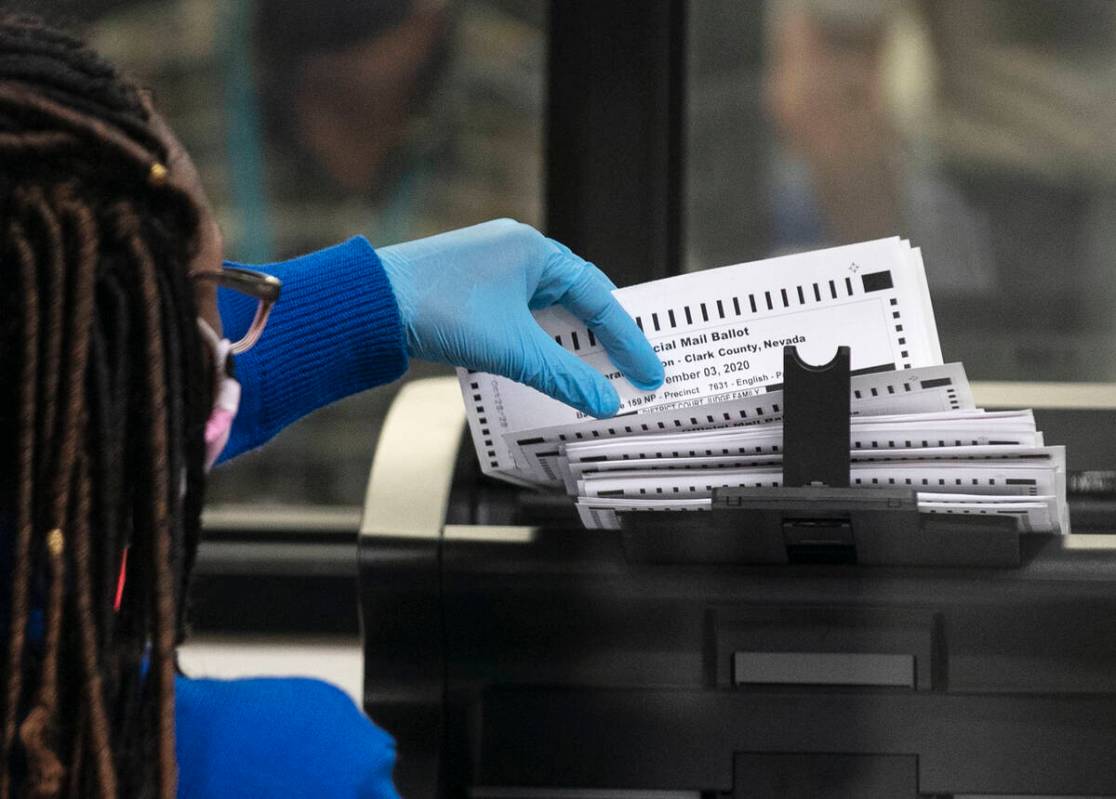 A Clark County election worker scans ballots at the Election Department warehouse, on Tuesday, ...