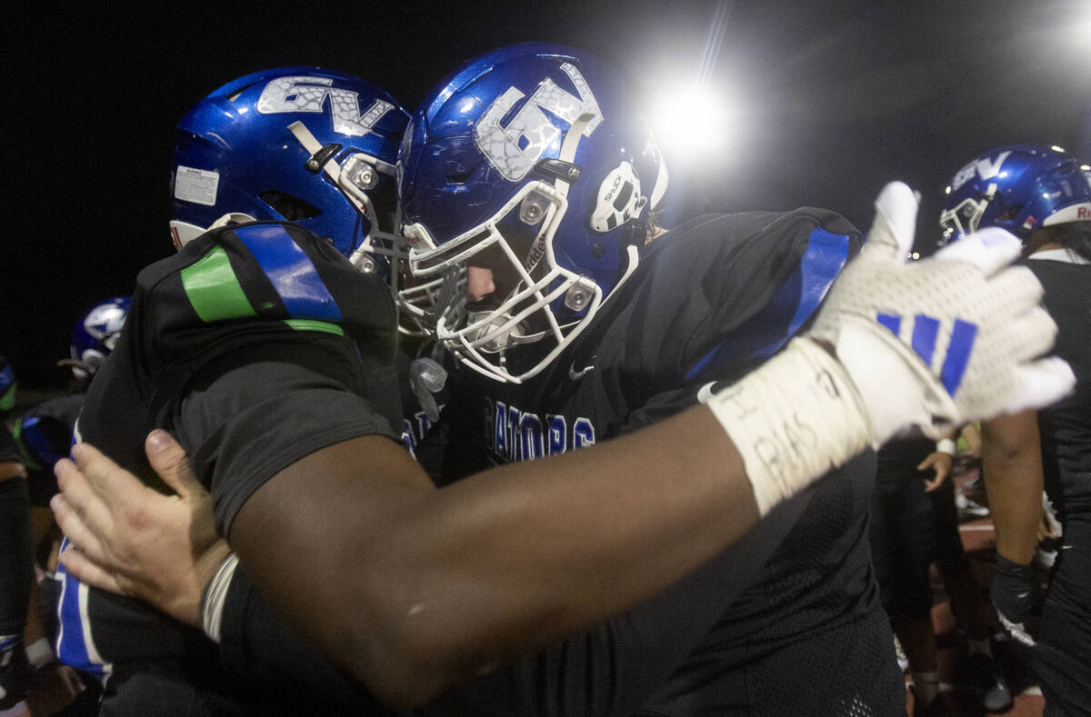 Green Valley running back Elyjah Cobwell, left, and Green Valley senior Jaden Gaughan, right, c ...