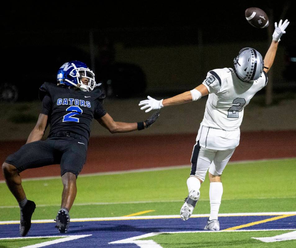 Green Valley junior Evan Williams (2) falls back as Palo Verde senior Slade Knoch (2) attempts ...