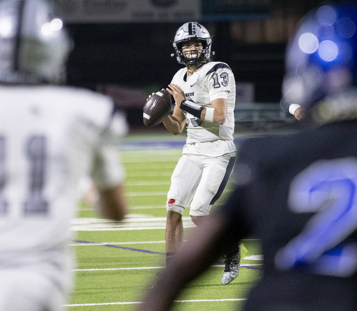 Palo Verde senior Dawson Perkes (13) looks to throw the ball during the final minute of the 5A ...