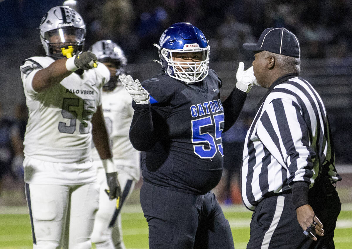 Green Valley defensive tackle Ethan Mckenzie (55) pleads his innocence as a flag is thrown duri ...