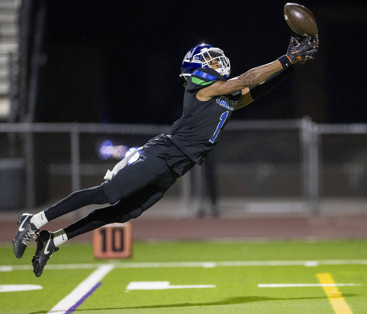 Green Valley senior Trey Glasper (1) dives for a long pass, eventually dropping the ball during ...