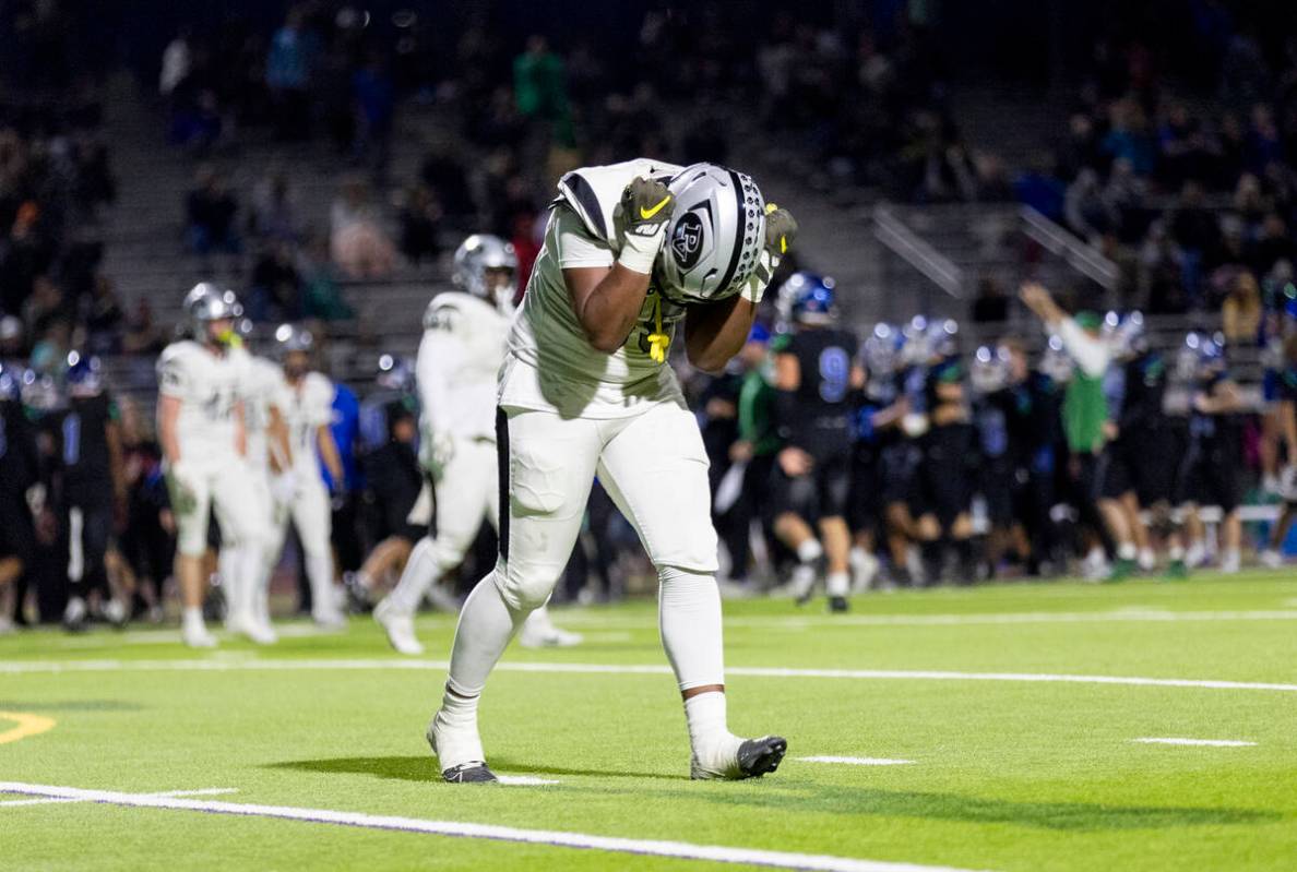 Palo Verde sophomore Justin Chandler (55) becomes frustrated after Green Valley players managed ...