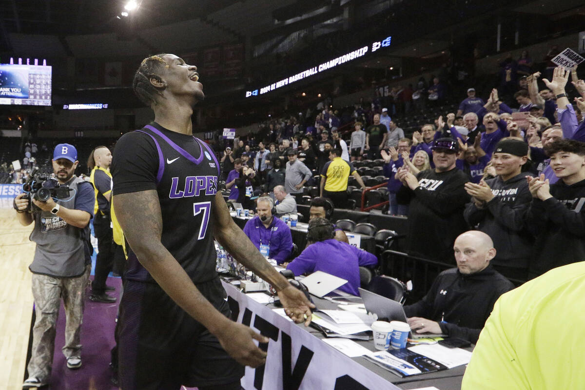 Grand Canyon guard Tyon Grant-Foster (7) celebrates with fans after the team's win against Sain ...