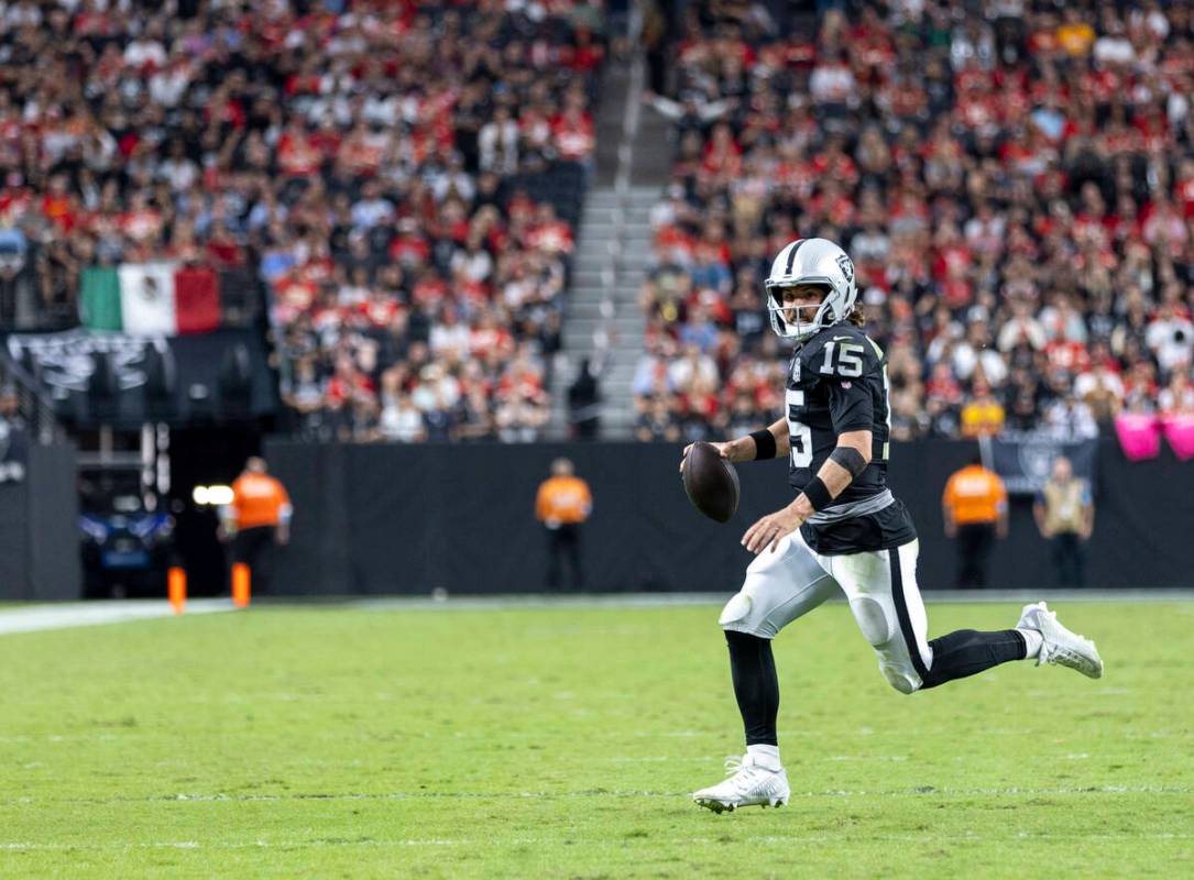 Raiders quarterback Gardner Minshew (15) runs with the ball during the second half of the NFL f ...