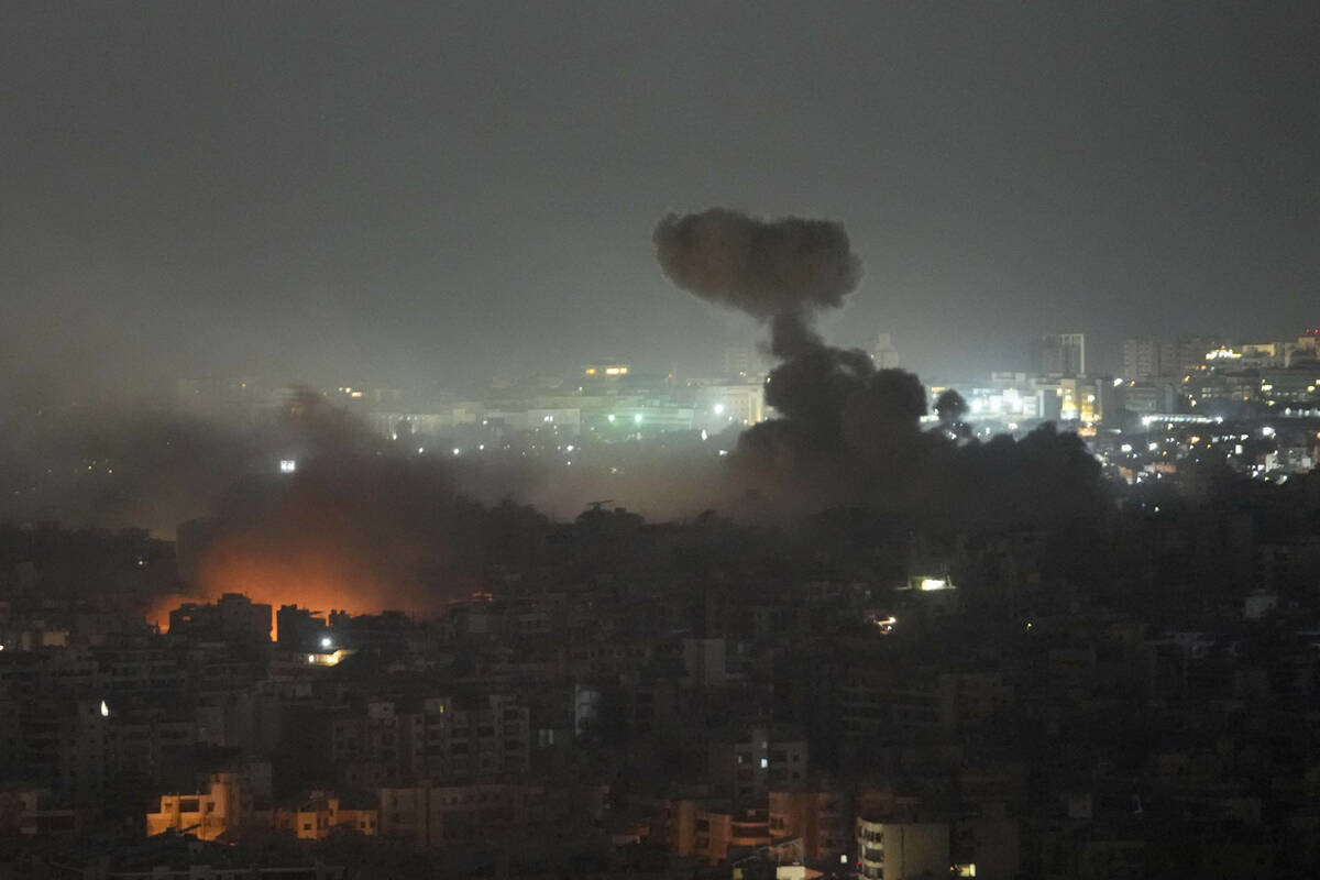 Flame and smoke rise from Israeli airstrikes on Dahiyeh, in the southern suburb of Beirut, Leba ...