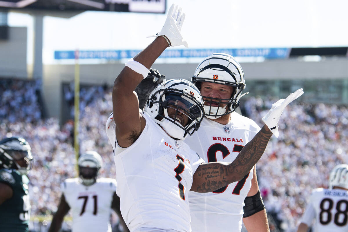 Cincinnati Bengals wide receiver Ja'Marr Chase (1) celebrates a touchdown in the first half dur ...