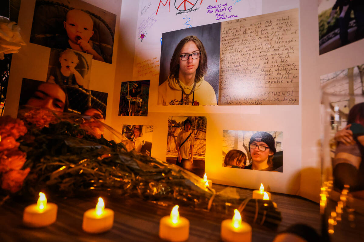 Flowers and candles are laid out for 17-year-old Jonathan Lewis on the one-year anniversary of ...