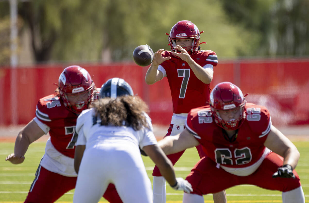 Arbor View quarterback Thaddeus Thatcher (7) snaps the ball during the high school football gam ...