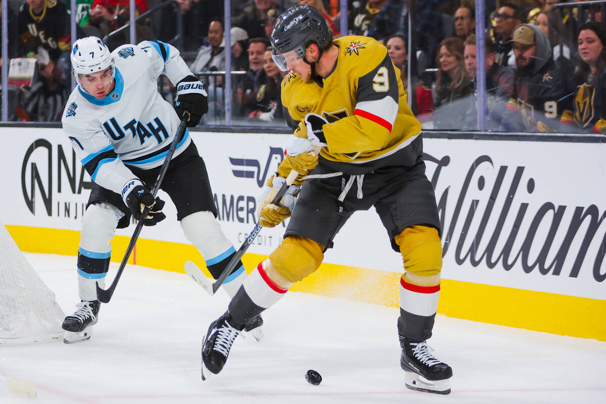 Golden Knights center Jack Eichel (9) reaches back for the puck as Utah Hockey Club defenseman ...