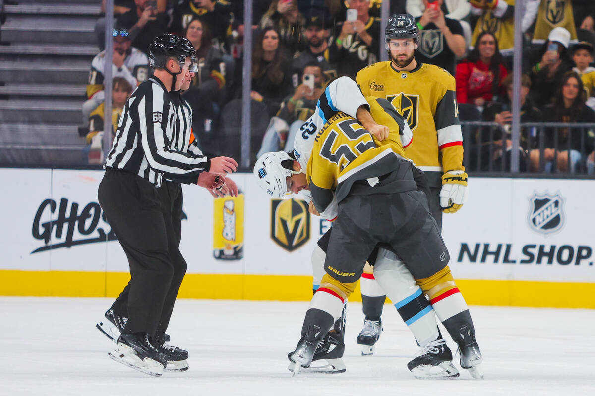 Golden Knights right wing Keegan Kolesar (55) and Utah Hockey Club center Jack McBain (22) figh ...