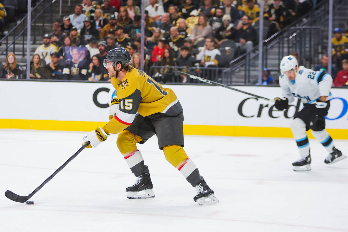 Golden Knights defenseman Noah Hanifin (15) rushes the puck down the ice during an NHL hockey g ...