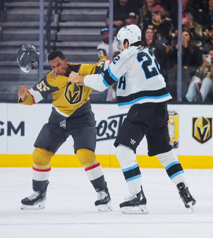 Golden Knights right wing Keegan Kolesar (55) throws a punch at Utah Hockey Club center Jack Mc ...