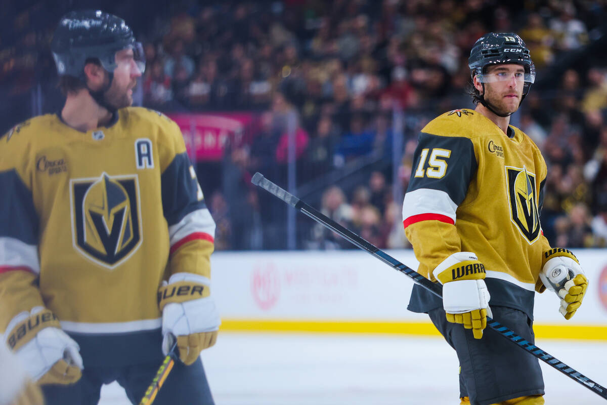 Golden Knights defenseman Noah Hanifin (15) skates into position for a puck drop during an NHL ...